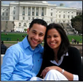 Hugo & Alfonsina Carabello sitting and smiling outside large white building in Milton, Massachusetts