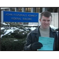 Niall McManus posing with blue paper in Beverly, Massachusetts