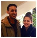 Julia & Mihir Shah. smiling for a picture in Boston, MA