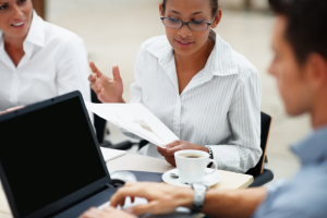 Group of businesspeople discussing documents