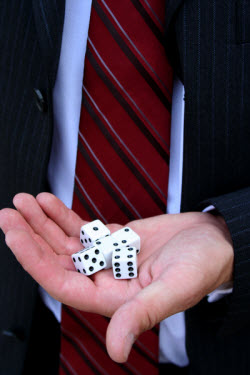 Businessman holding a group of dice