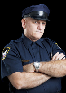 Police officer with his arms crossed