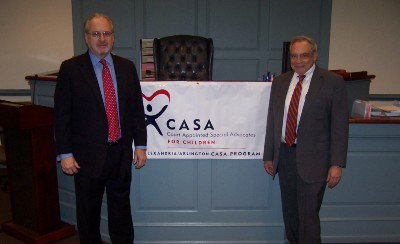 Mark and David in Front of "Court Appointed Special Advocates for Children" Banner