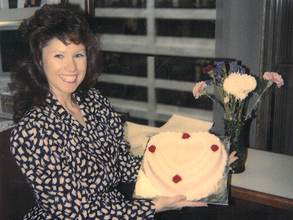 Vicky Collins with Cake and Flowers