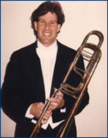  Isaiah in white tie and tails holding his trombone