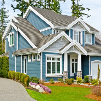 Front shot of a nice house and it's lawn