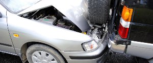 Silver car rear-ending a black SUV-1