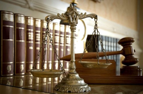 Scales of justice next to gavel