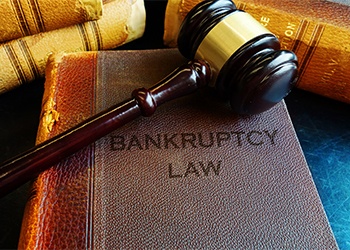 Gavel on top of book reading Bankruptcy Law