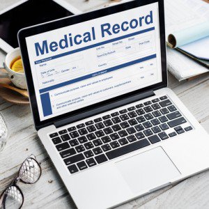 computer with the words medical record on it