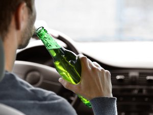 Man drinking and driving