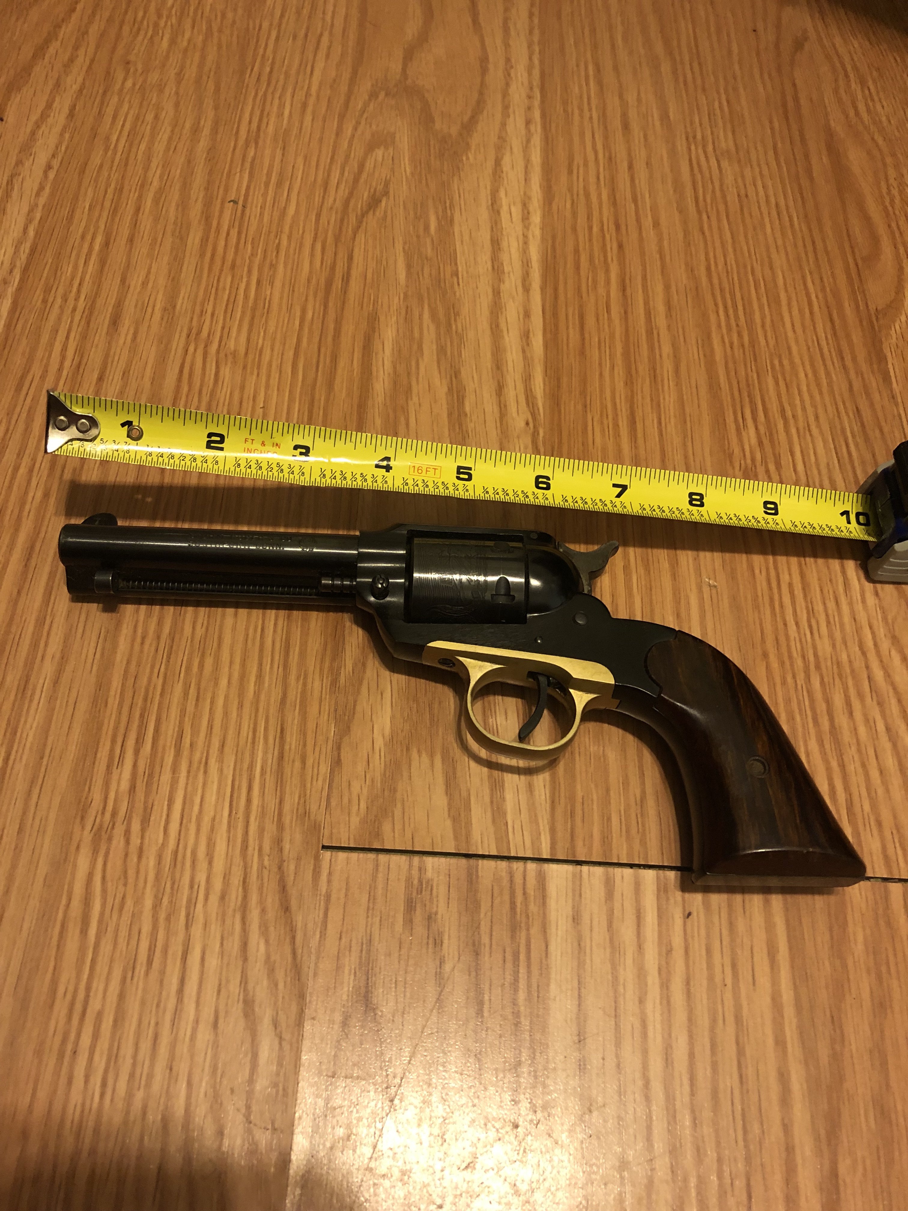 Gun with tape measure