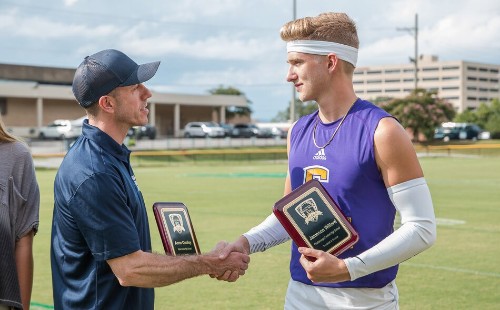 Scholarship Winner Shaking Hands with Attorney Fisher Wise