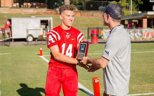 Scholarship Winner Shaking Hands with Attorney Fisher Wise