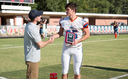 Scholarship Winner Shaking Hands with Attorney Fisher Wise