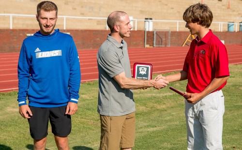 Scholarship Winner Shaking Hands with Attorney Fisher Wise