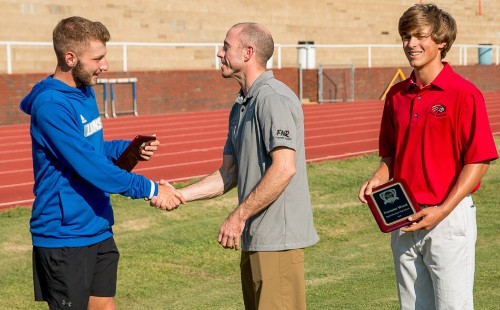 Scholarship Winner Shaking Hands with Attorney Fisher Wise