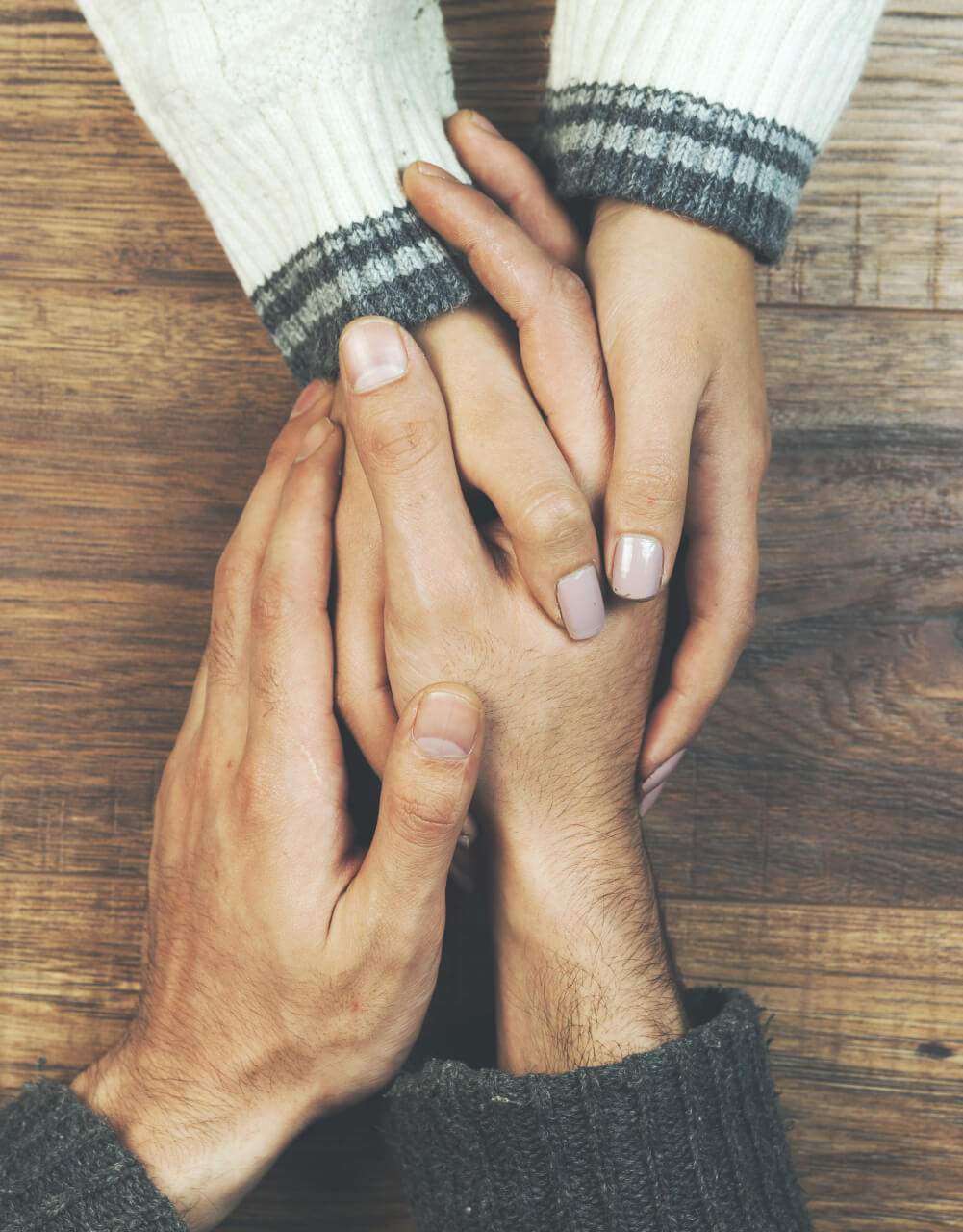 Hands holding each other