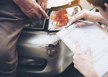 Insurance agent working during on site car accident