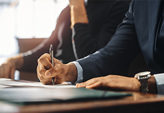 lawyer signing a document