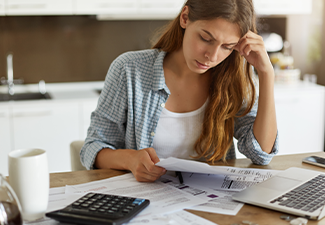 woman depressed while on debt