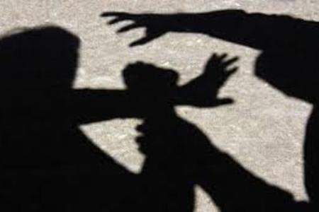 Shadows of someone hitting another