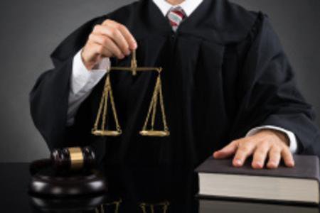 judge holding scale of justice