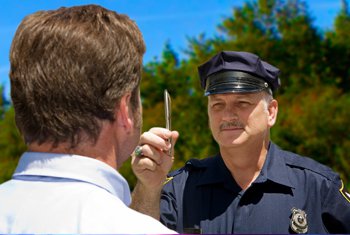 Officer performing sobriety test on man