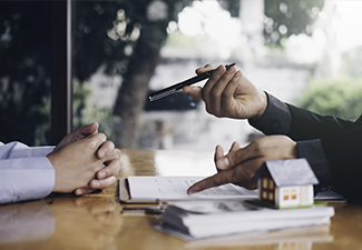 Real Estate Agent Holding House Key to His Client