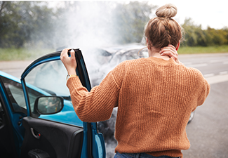 Female Motorist with Head Injury Getting out Of Car After Crash