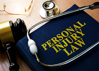 Personal Injury Law concept Written on a Book and stethoscope