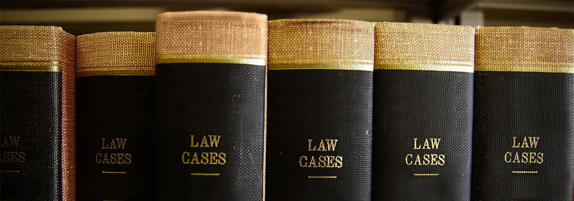 Row of black and gold law case books