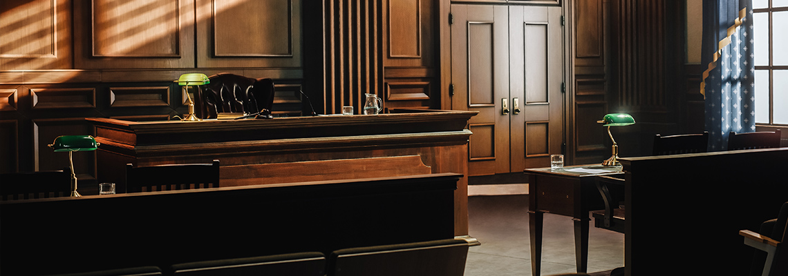 Empty courtroom with desks and gallery seats