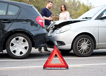 People checking car damages after car accident