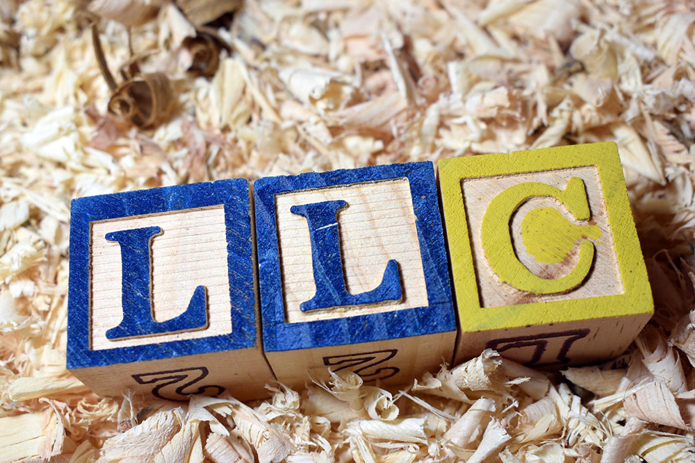 Letter blocks spelling out LLC