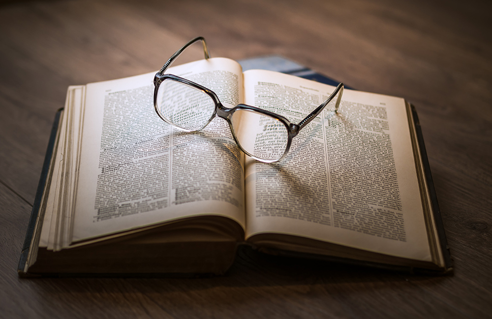 Glasses and open book