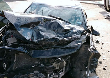 Photo of car after major accident, front crumpled