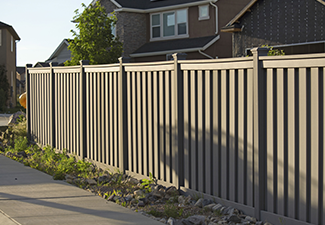 Shot of the fence around the house in the neighborhood during the sunset.