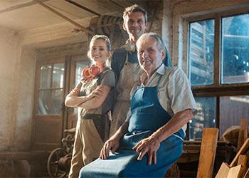 Generations of carpenters in their family business workshop
