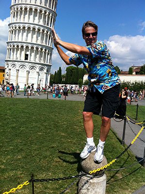 Attorney J. Jason Bangos Standing on Rock and Touching the Leaning Tower of Pisa