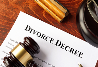 Divorce decree and gavel on a table.