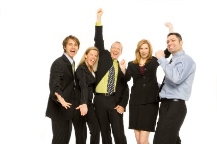 Group of people with fists in the air victoriously