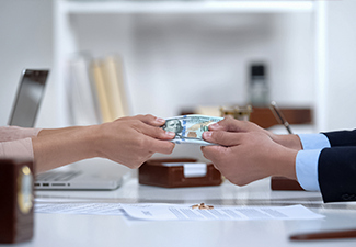 Male and Female Hands Pulling Money