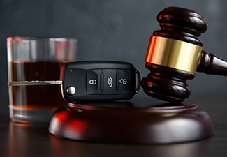 Law Hammer, Alcohol and Car Keys on Wooden Table