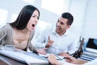 Young couple in meeting women is upset and man is happy