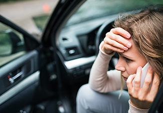 Young Woman in The Damaged Car After a Car Accident