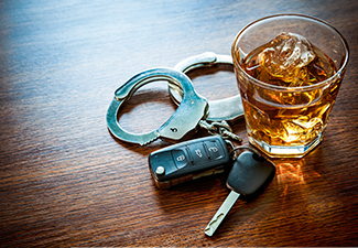 Handcuff, Glass of Alcohol and Car Key