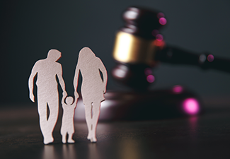 Family Figure and Gavel on Table