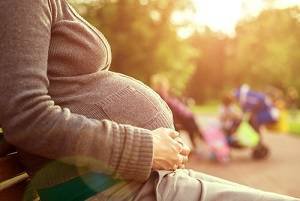 Pregnant woman in park