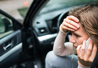 Woman in The Damaged Car After a Car Accident